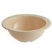A tan melamine bowl with a white rim.