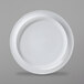A close-up of a Corona by GET Enterprises bright white porcelain plate with a white border.