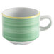 A green porcelain tea cup with a handle.