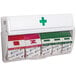 A white San Jamar wall-mounted Mani-Kare bandage dispenser with different colored labels.
