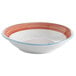 A bright white porcelain bowl with a red and blue rim.