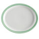 A white porcelain oval platter with a narrow green and yellow rim.