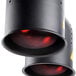 A pair of black cylindrical heat lamps with red bulbs.