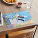 A table with a Choice Kids Under the Sea Interactive Placemat on it.