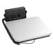 A white and silver Avaweigh low-profile digital receiving scale with a black rectangular remote display cord.