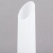 A white plastic sausage stuffer tube with a curved, pointy tip.