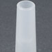 A white plastic sausage stuffer tube with a small hole at the end.