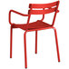 A Lancaster Table & Seating red outdoor arm chair with metal legs.