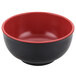 A white melamine bowl with a black and red rim.