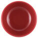 A close-up of a red GET melamine bowl with a white border.