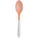 A Pearl to Orange color-changing dessert spoon with a white handle.