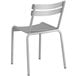 A white Lancaster Table & Seating aluminum outdoor side chair with a backrest.