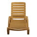 A tan plastic Lancaster Table & Seating chaise lounge chair.