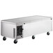 A large rectangular silver Beverage-Air freezer chef base with wheels.