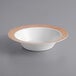 A white Visions plastic bowl with a rose gold lattice design.