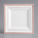 A white square Visions plastic plate with rose gold trim.