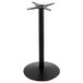 A black metal Holland Bar Stool outdoor bar height table base with a metal pole and round base.