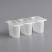 Three San Jamar translucent plastic food containers with lids on a gray surface.