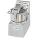 A Robot Coupe stainless steel commercial food processor with a mini bowl and lid.