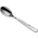 A Visions silver plastic spoon with a textured handle.