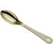 A close up of a Visions heavy weight gold plastic spoon with a silver handle.