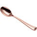 A close-up of a Visions rose gold plastic spoon.