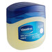 A plastic container of Vaseline petroleum jelly with a blue lid.