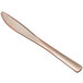 A close up of a Visions rose gold plastic knife.