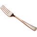 A close up of a Visions rose gold plastic fork.