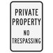 A white Lavex aluminum sign with black text that says "Private Property / No Trespassing"