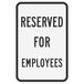 A white rectangular sign with black text that reads "Reserved for Employees" above the Lavex logo.