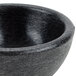 A black Polypropylene Molcajete bowl with a handle.