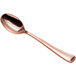 A Visions rose gold plastic spoon with a close-up of the handle.