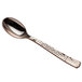 A Visions rose gold plastic spoon with a textured metal handle.
