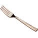 A close-up of a Visions Hammersmith rose gold plastic fork with a white background.