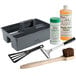 A grey tool box containing a cleaning brush and cleaning tool for a Cooking Performance Group countertop griddle.
