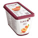 A container of Les Vergers Boiron apricot fruit puree with a label.