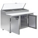 A Beverage-Air stainless steel refrigerated pizza prep table with two clear glass doors.