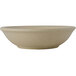 A close-up of a rectangular Tuxton China bowl with a matte beige finish.