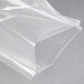 A clear plastic bag of ARY VacMaster chamber vacuum packaging bags on a grey surface.