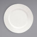 A white Front of the House Catalyst porcelain plate with an embossed thin stripe design.