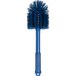 A blue Carlisle Sparta cleaning brush with a handle.