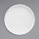 A white Front of the House Soho porcelain plate with a raised white rim on a gray surface.