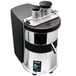 A close-up of a black and silver Ceado ES700 juice extractor with two chutes.