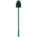 A Carlisle green multi-purpose cleaning brush with a green handle.