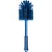 A blue Carlisle Sparta multi-purpose cleaning brush with a handle.