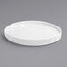 A Front of the House Soho bright white porcelain plate with a raised rim on a gray surface.