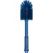 A blue brush with a long handle and bristles.