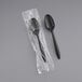 Two black Choice medium weight plastic spoons in plastic wrap.