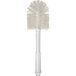 A white brush with a white handle and 5" diameter bristles.